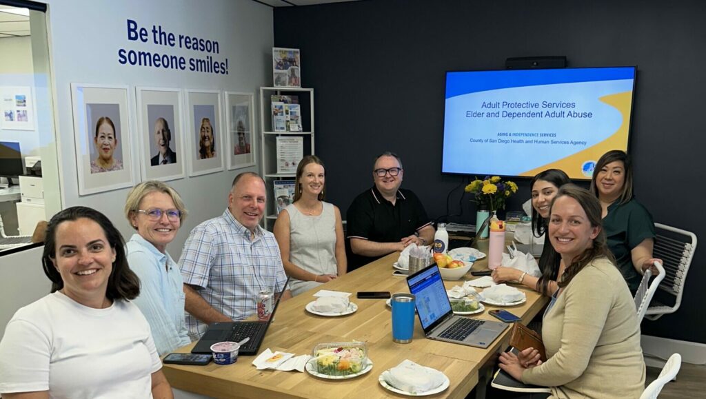 Jonathan Tague presenting on elder abuse reporting at a Cheer Home Care event in San Diego.